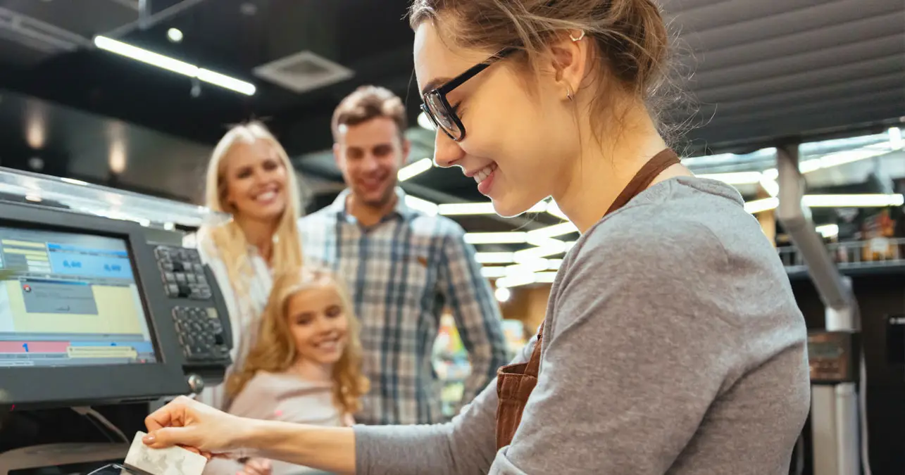 Sales woman at cash counter